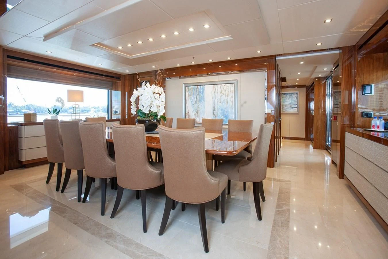 a large kitchen with a dining table aboard ALESSANDRA III Yacht for Charter