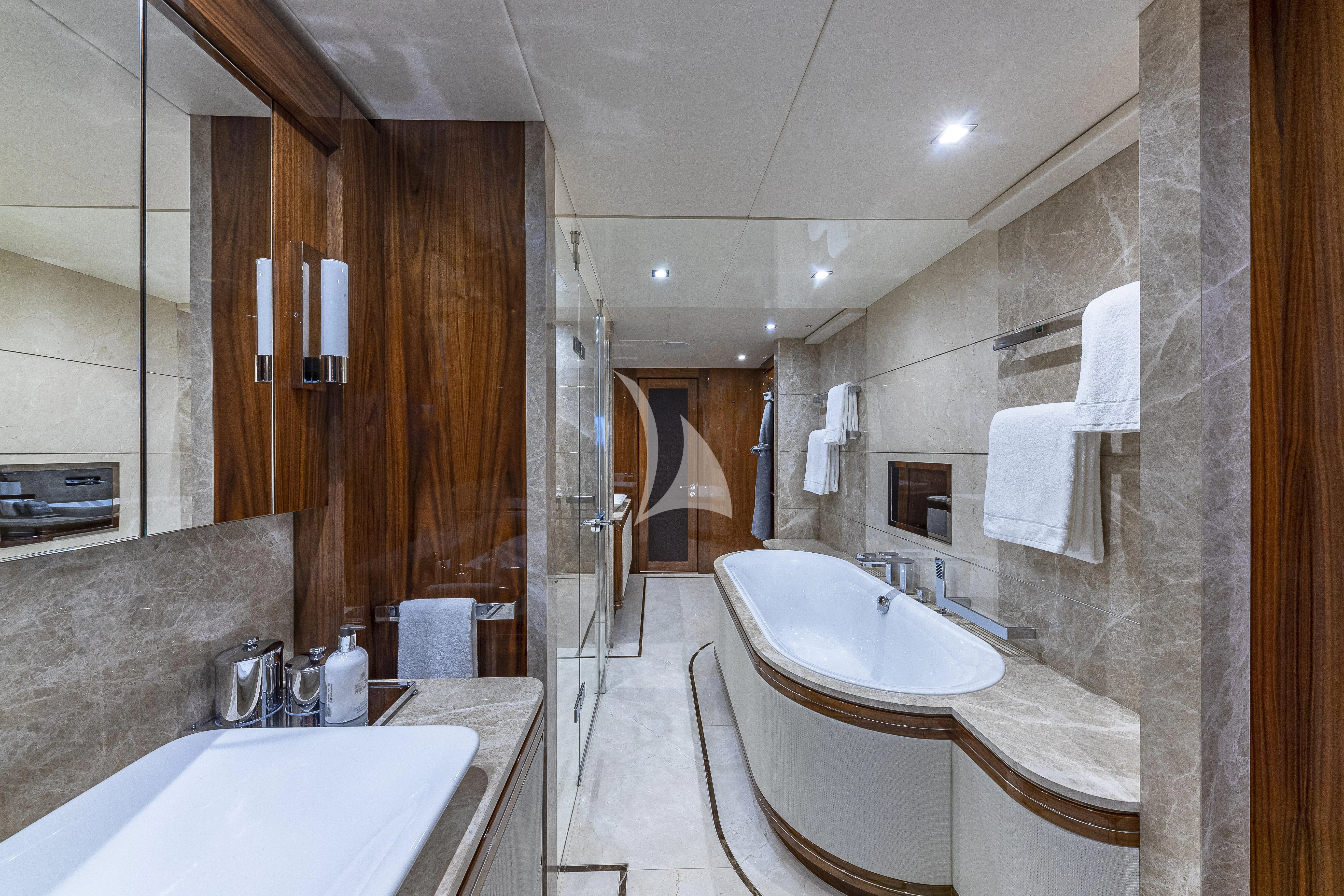 a bathroom with a sink and a mirror aboard ALESSANDRA III Yacht for Charter
