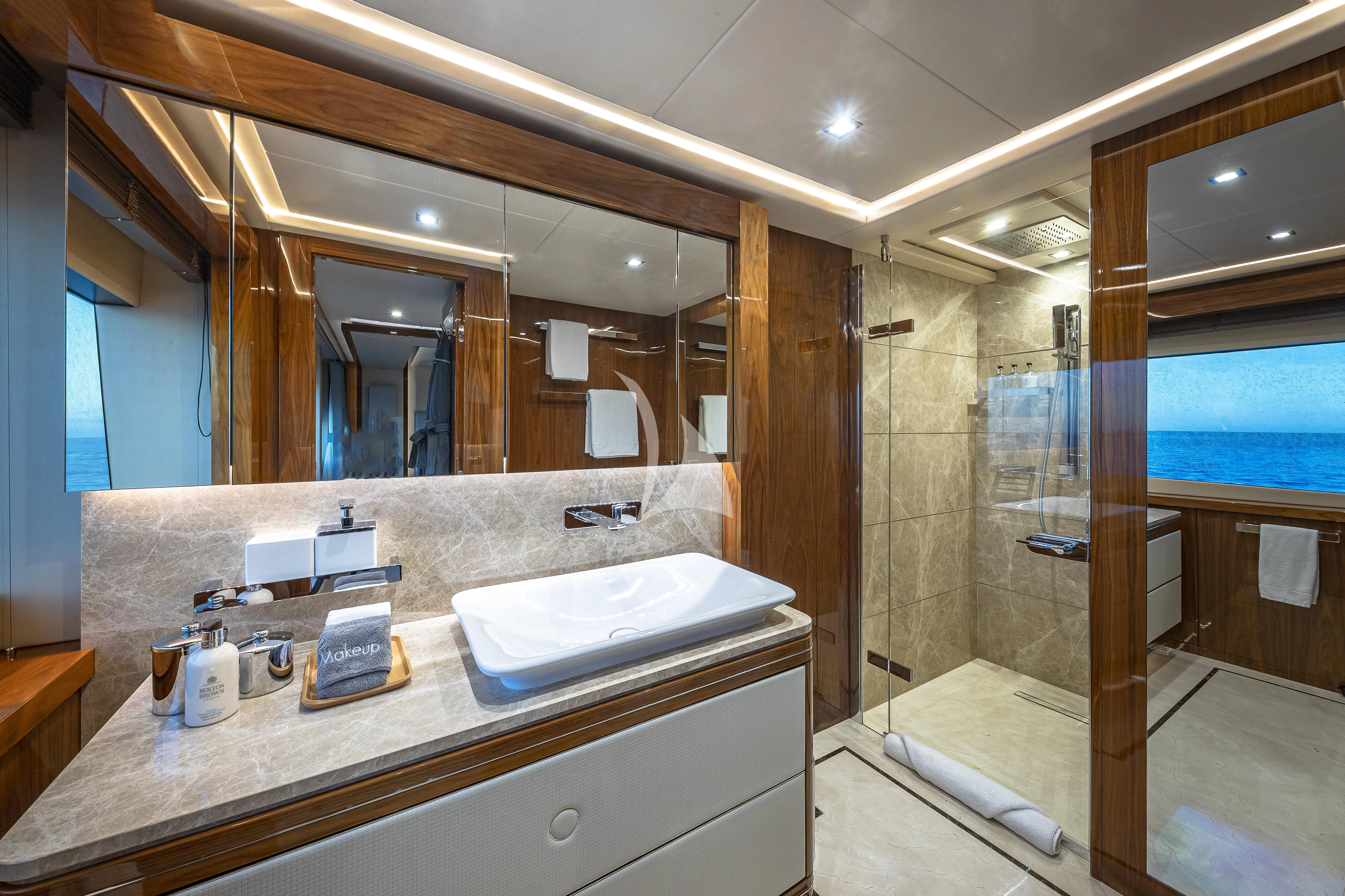 a bathroom with a large mirror aboard ALESSANDRA III Yacht for Charter