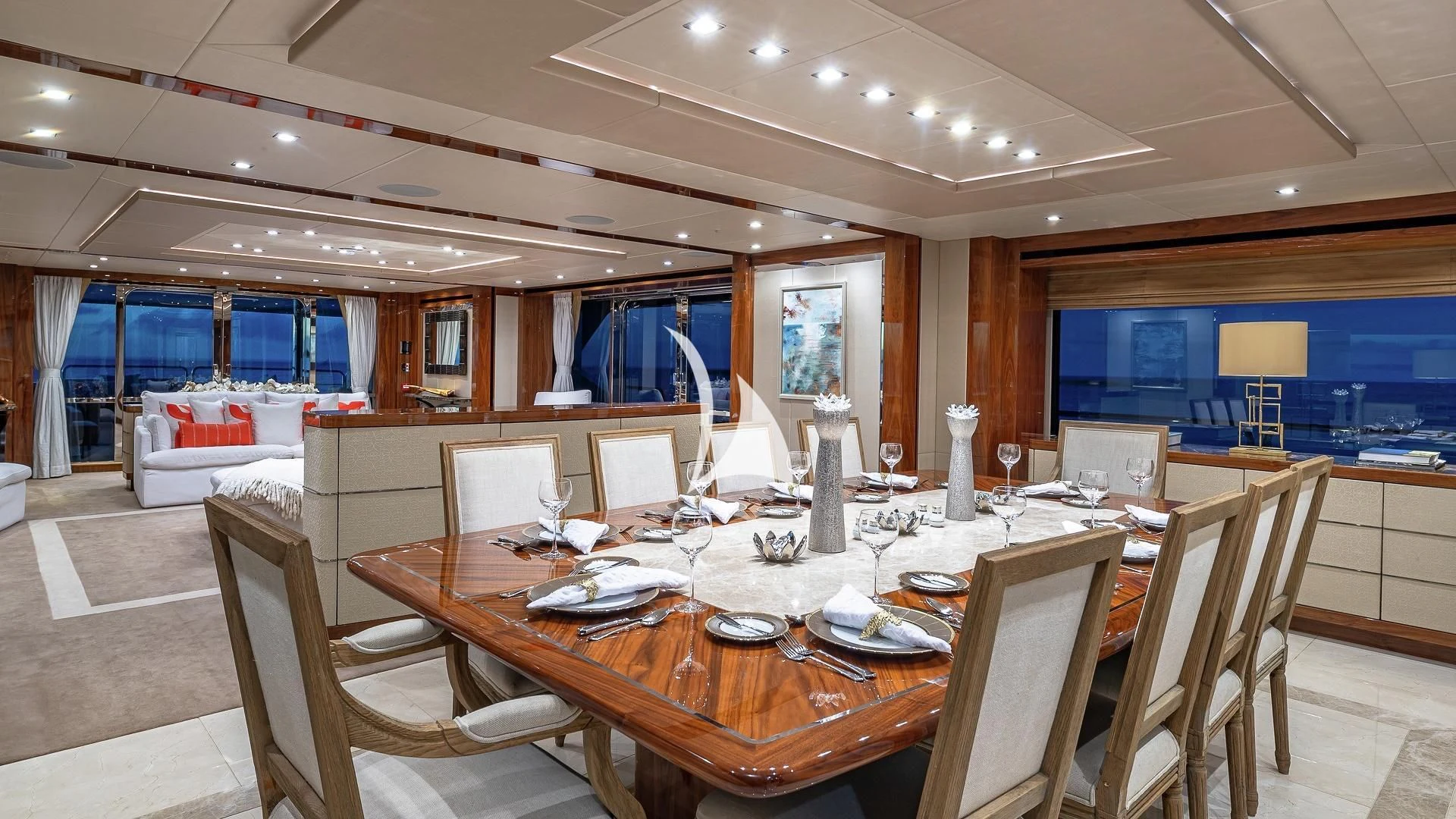 a large room with tables and chairs aboard ALESSANDRA III Yacht for Charter