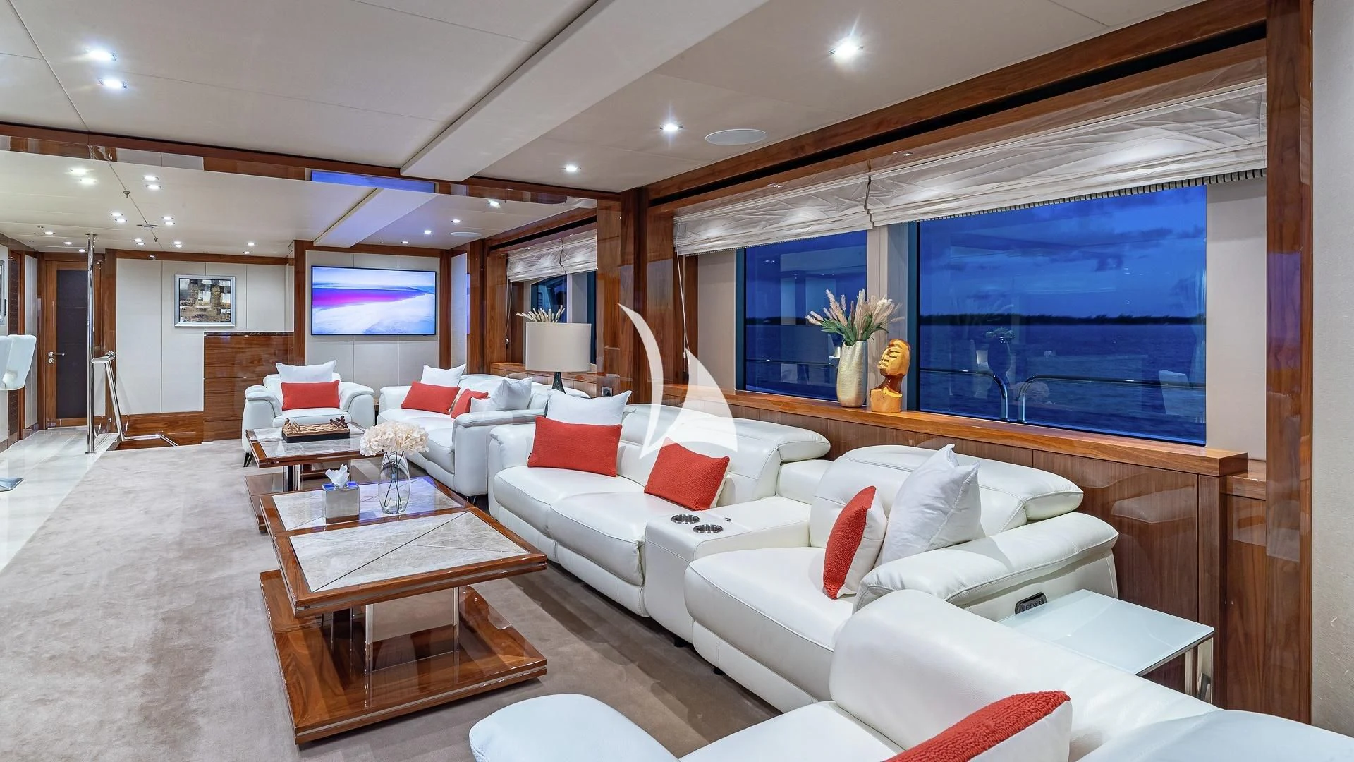 a living room with a large screen aboard ALESSANDRA III Yacht for Charter