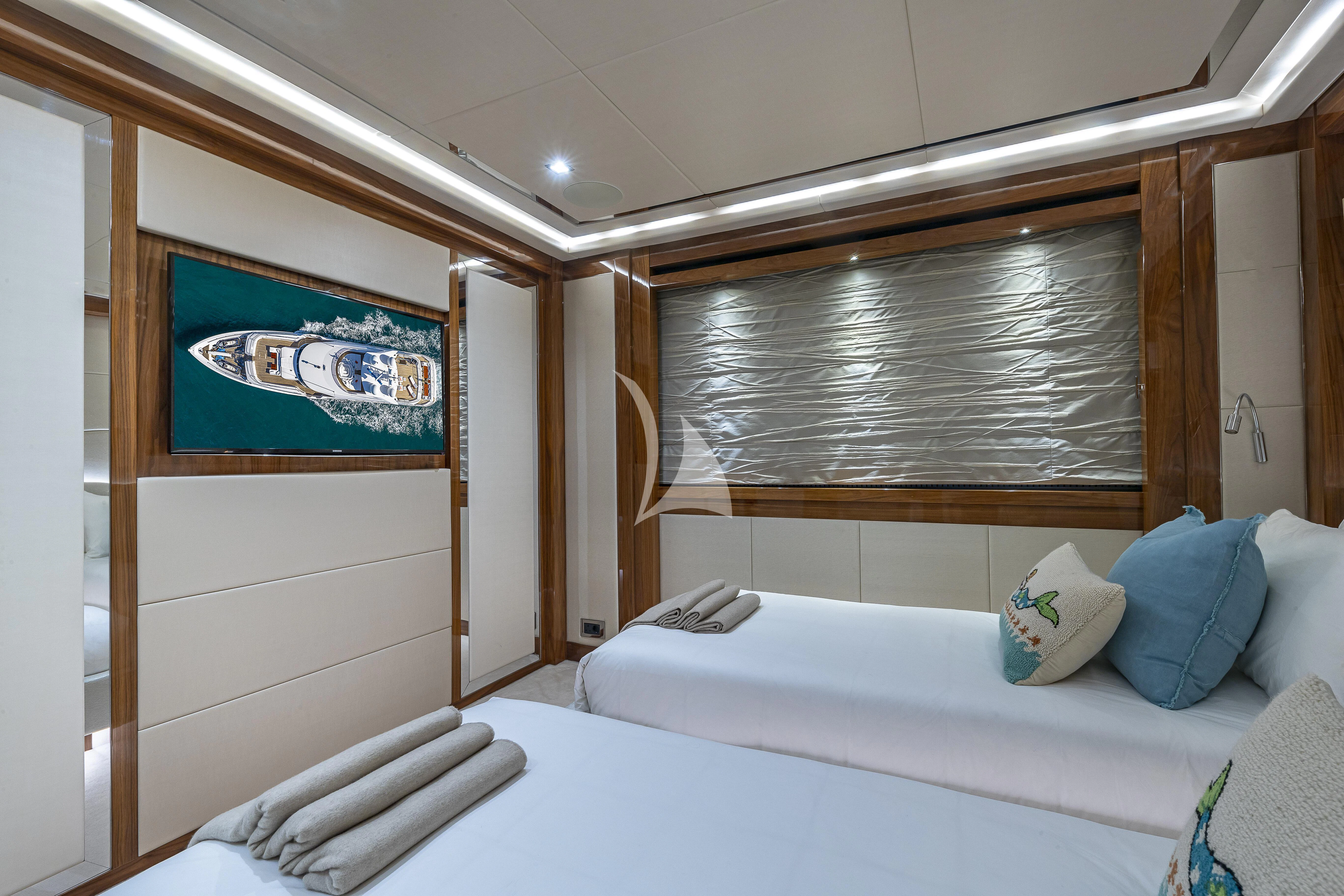 a room with a bed and a window aboard ALESSANDRA III Yacht for Charter