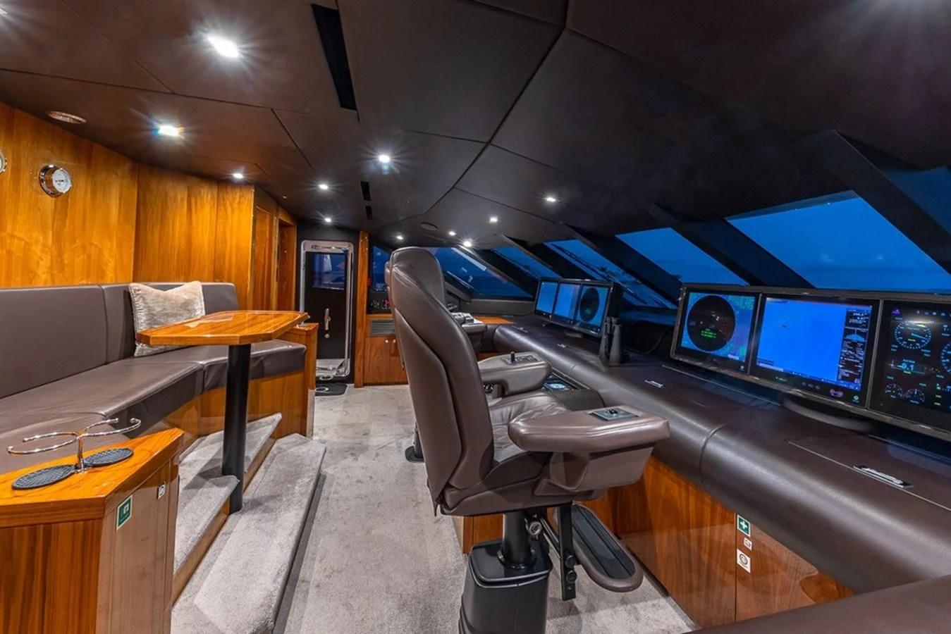 a room with a table and chairs aboard ALESSANDRA III Yacht for Charter