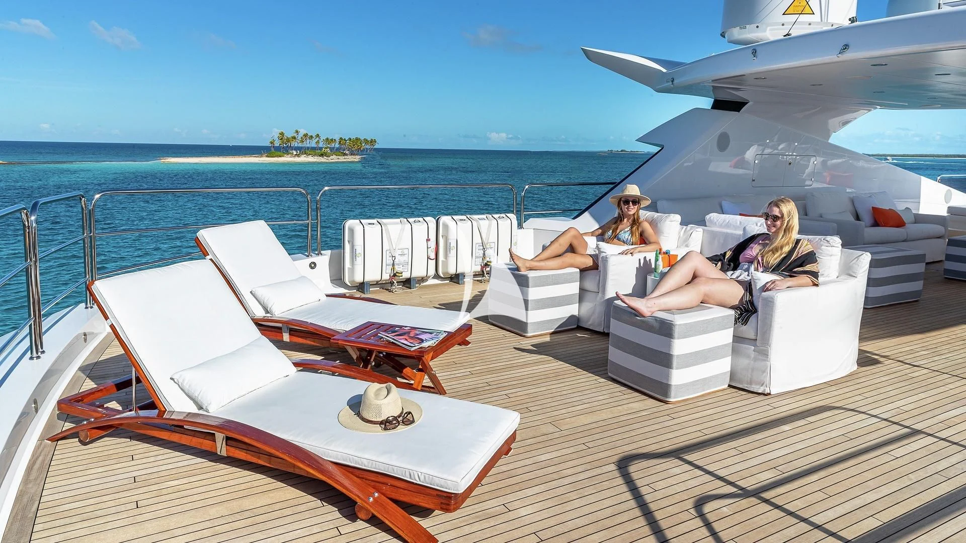 a couple sitting on a boat aboard ALESSANDRA III Yacht for Charter