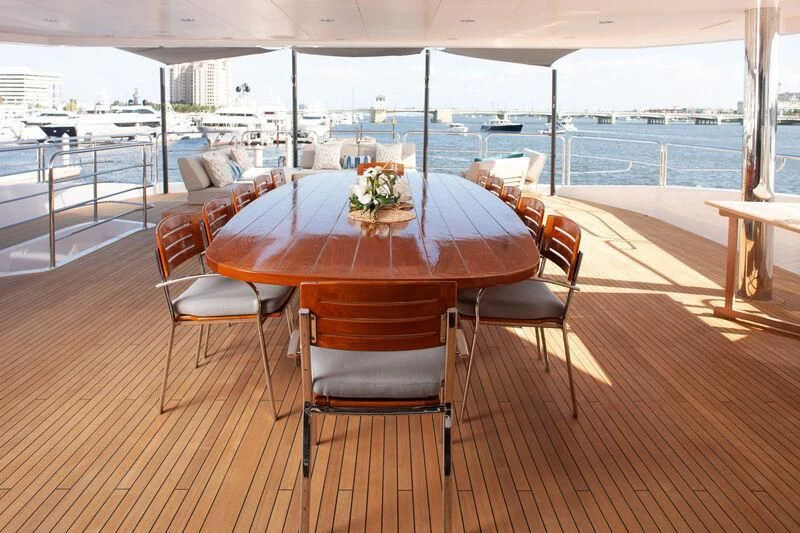 a table and chairs on a deck aboard ALESSANDRA III Yacht for Charter