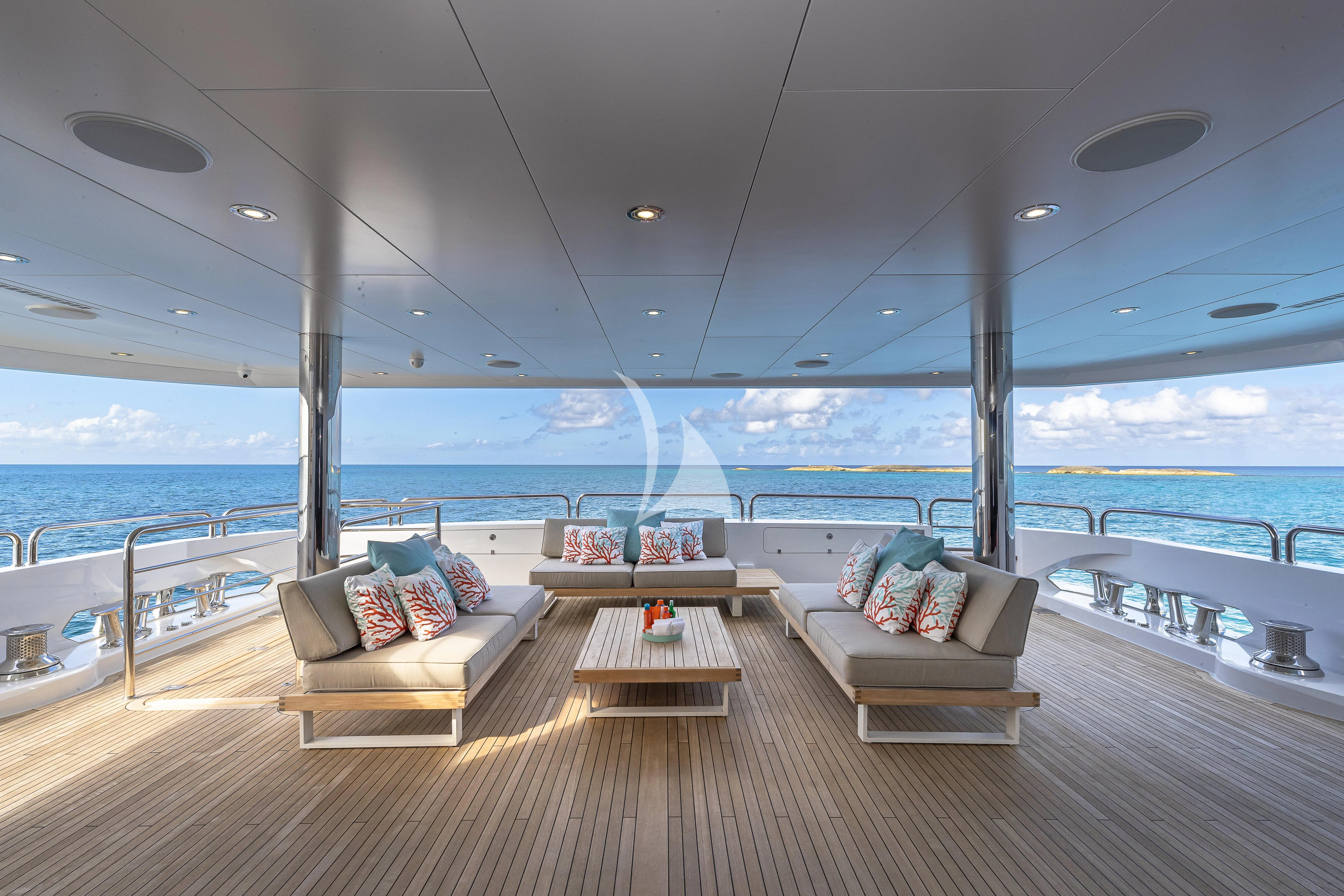 a room with a couch and a table on a boat aboard ALESSANDRA III Yacht for Charter