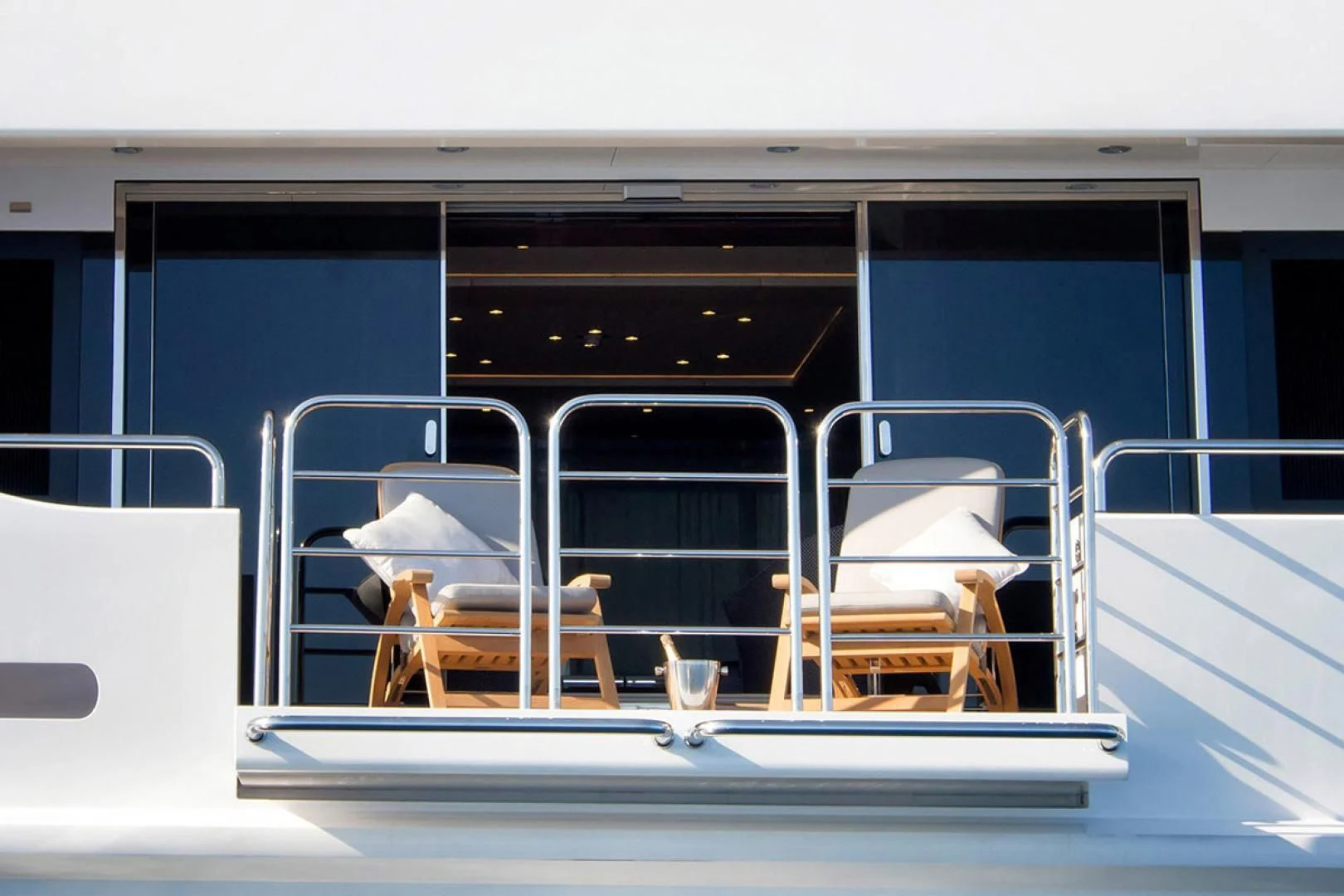 a group of chairs on a balcony aboard ALESSANDRA III Yacht for Charter
