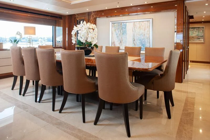 a room with chairs and tables aboard ALESSANDRA III Yacht for Charter