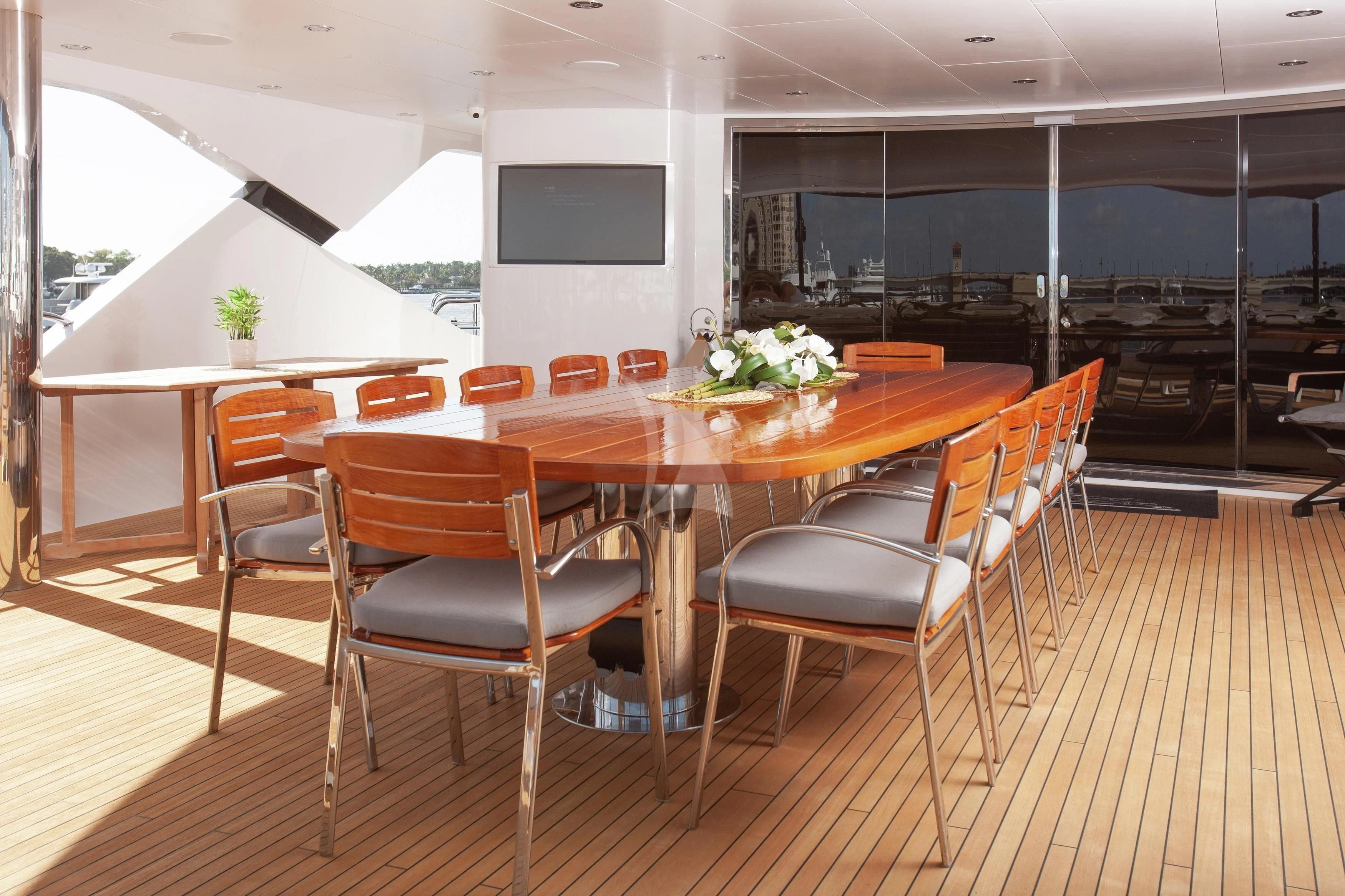 a room with a table and chairs aboard ALESSANDRA III Yacht for Charter
