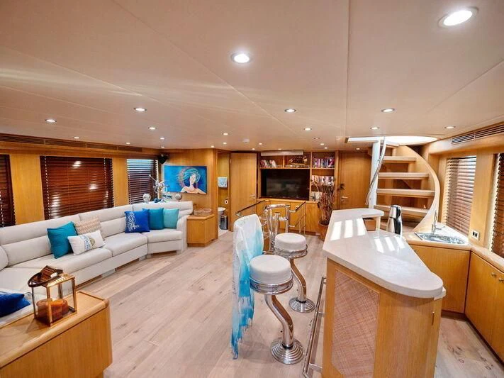 a living room with a couch and a table aboard BANDIDO I Yacht for Sale