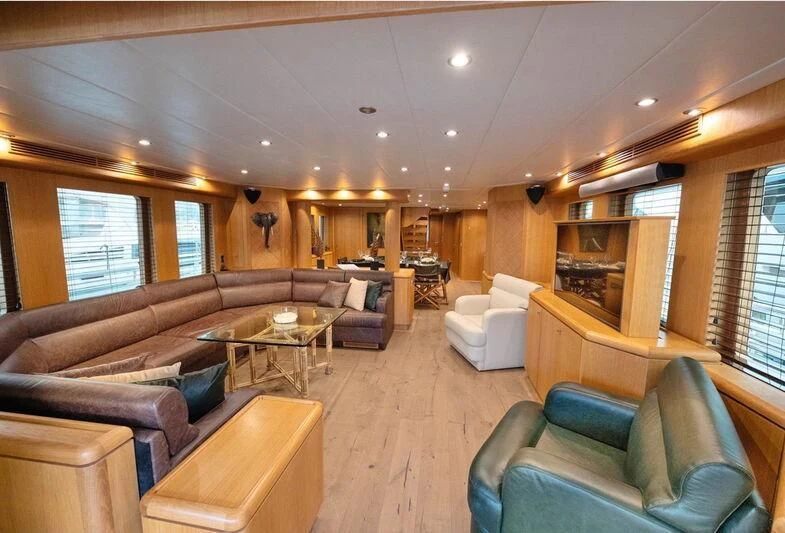 a living room with a couch and a table aboard BANDIDO I Yacht for Sale