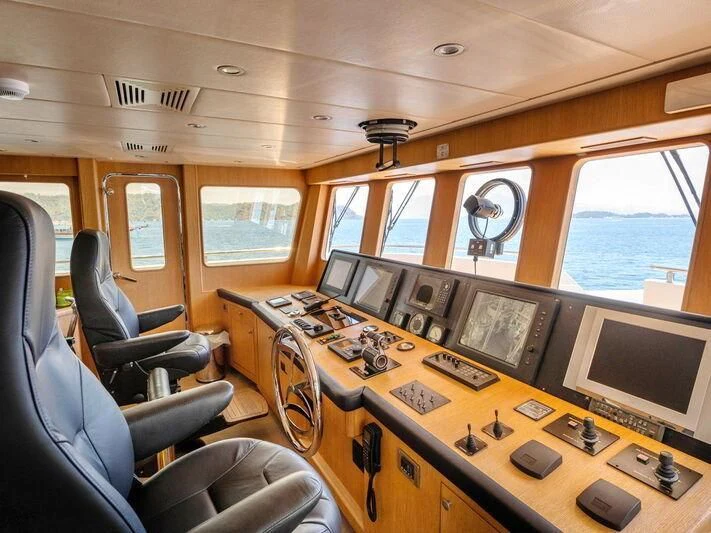 a control room with a large window aboard BANDIDO I Yacht for Sale