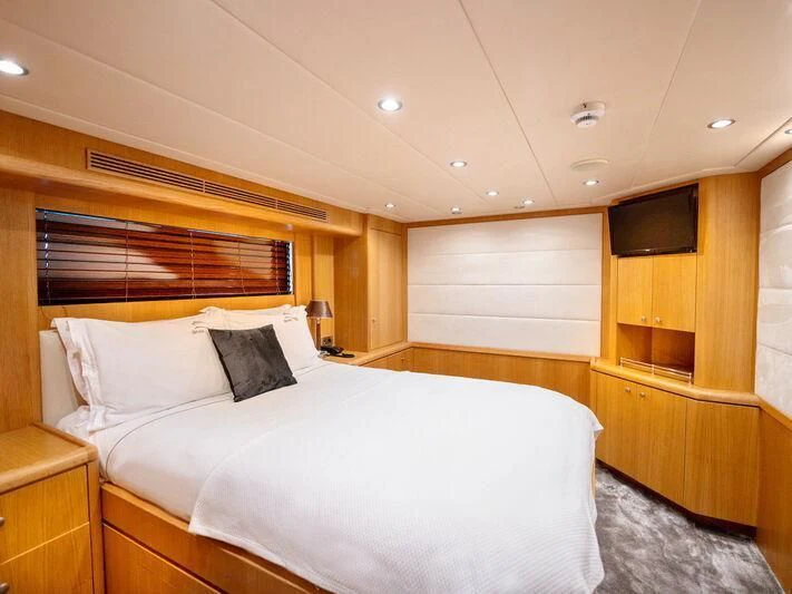 a bed with a white sheet aboard BANDIDO I Yacht for Sale