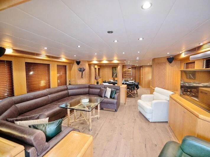 a living room with a couch and a coffee table aboard BANDIDO I Yacht for Sale