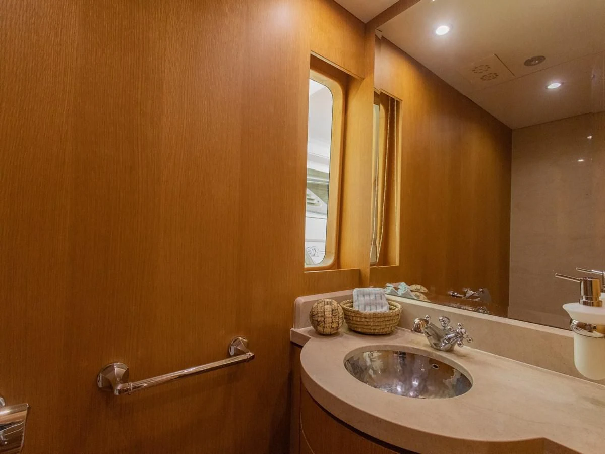 a bathroom with a mirror and a sink aboard BANDIDO I Yacht for Sale