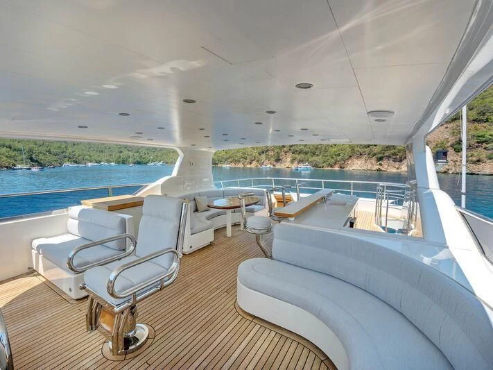 a room with a couch and a pool aboard BANDIDO I Yacht for Sale
