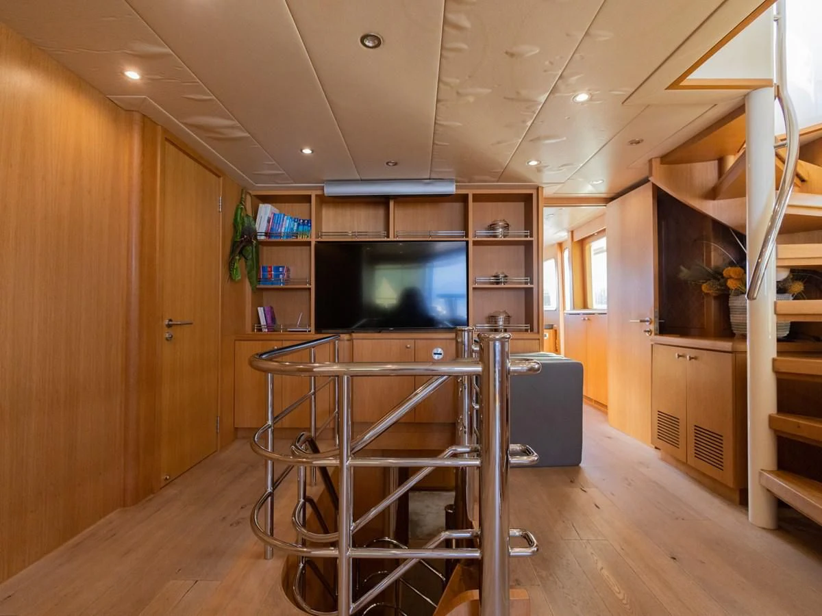 a room with a cart and a television aboard BANDIDO I Yacht for Sale