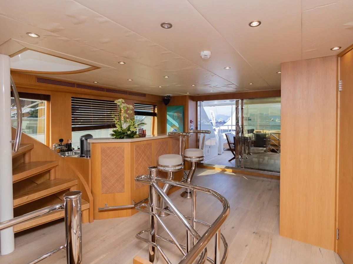 a room with a table and chairs aboard BANDIDO I Yacht for Sale