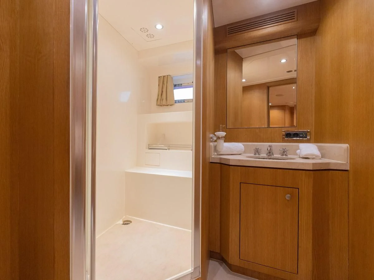 a bathroom with a sink and a mirror aboard BANDIDO I Yacht for Sale