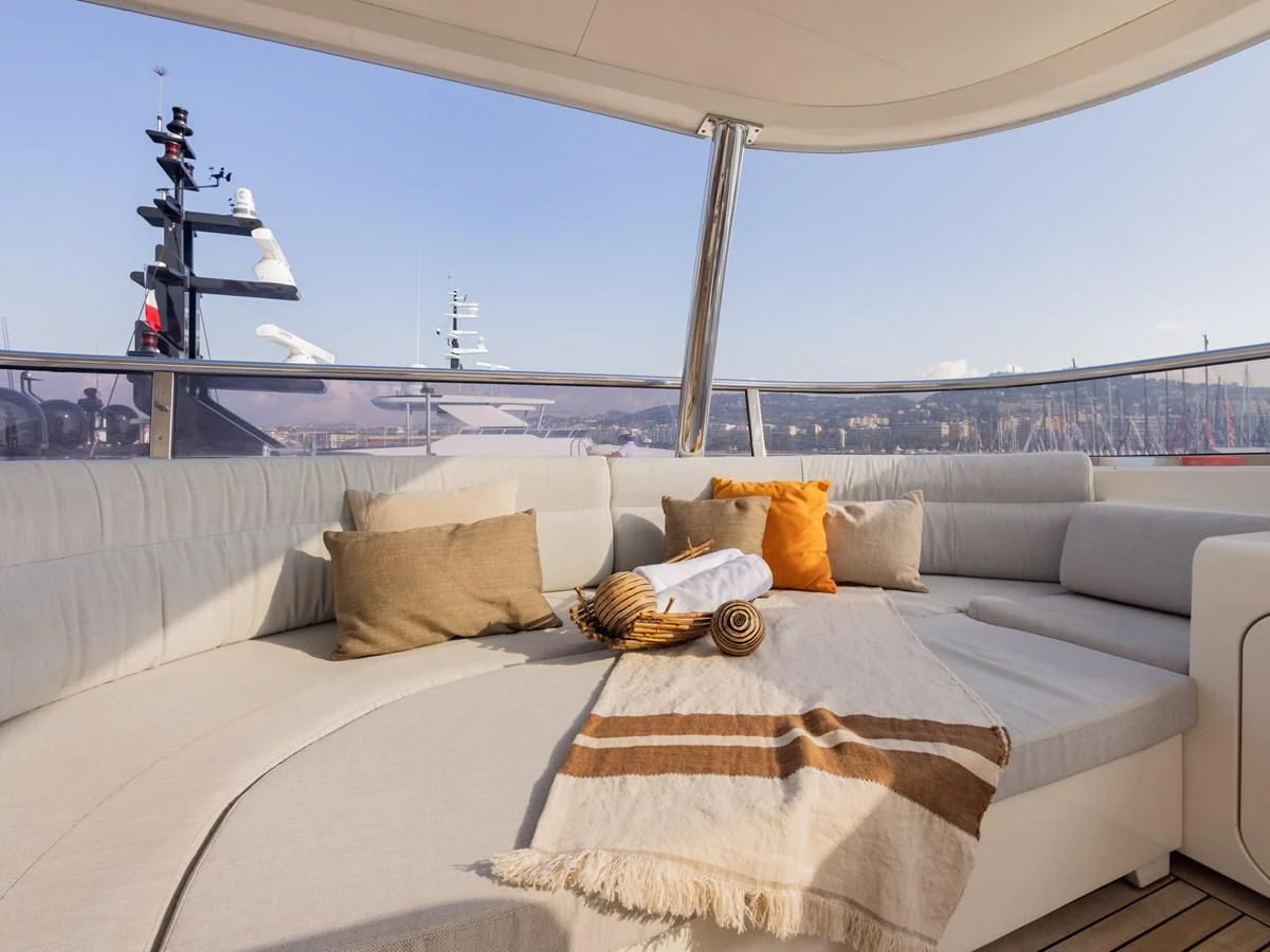 a white couch with pillows on it aboard BANDIDO I Yacht for Sale