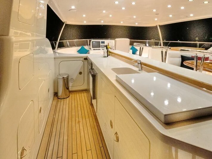 a kitchen with white cabinets aboard BANDIDO I Yacht for Sale