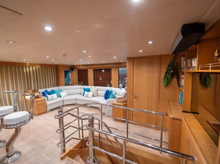 a room with a bed and a couch aboard BANDIDO I Yacht for Sale