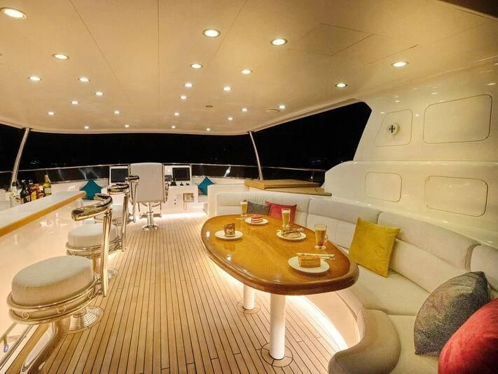 a room with a table and chairs aboard BANDIDO I Yacht for Sale