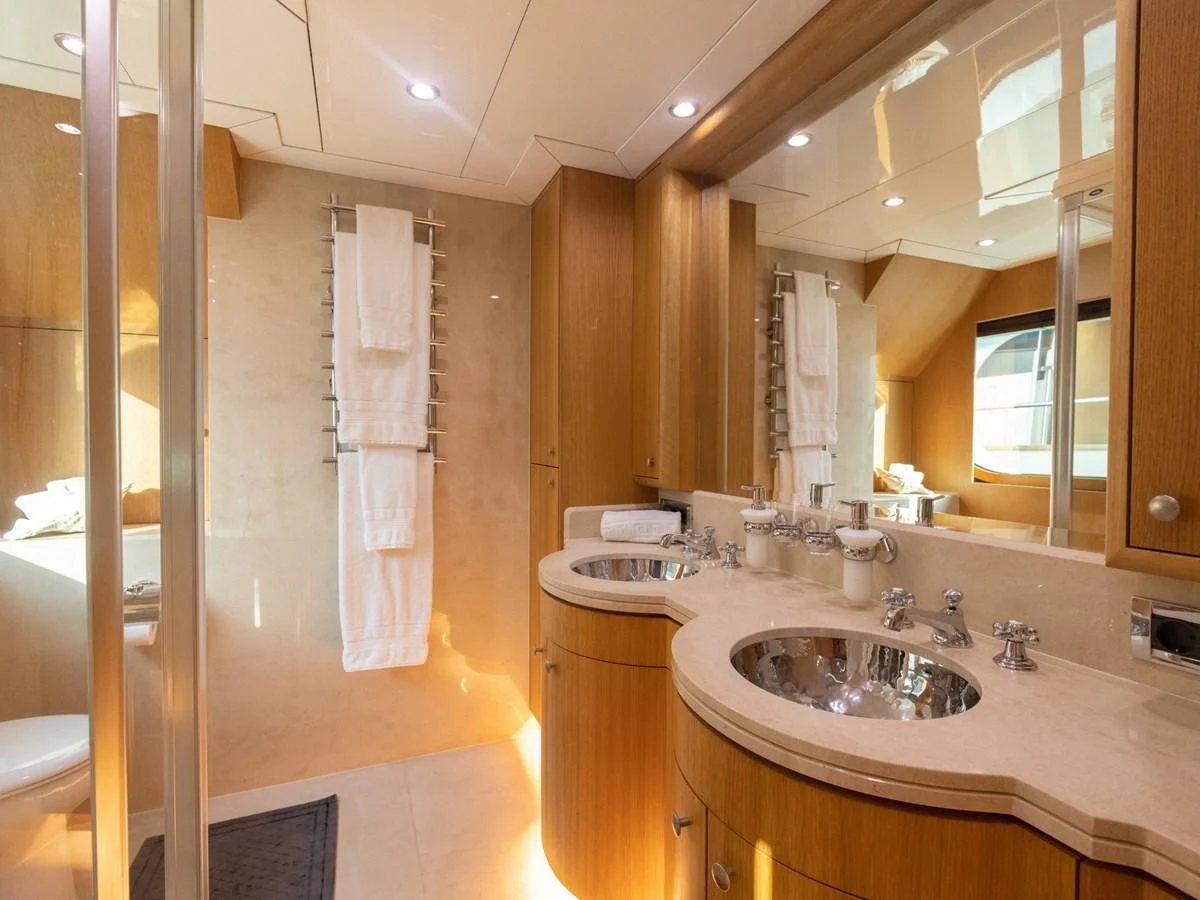 a bathroom with a shower and sink aboard BANDIDO I Yacht for Sale