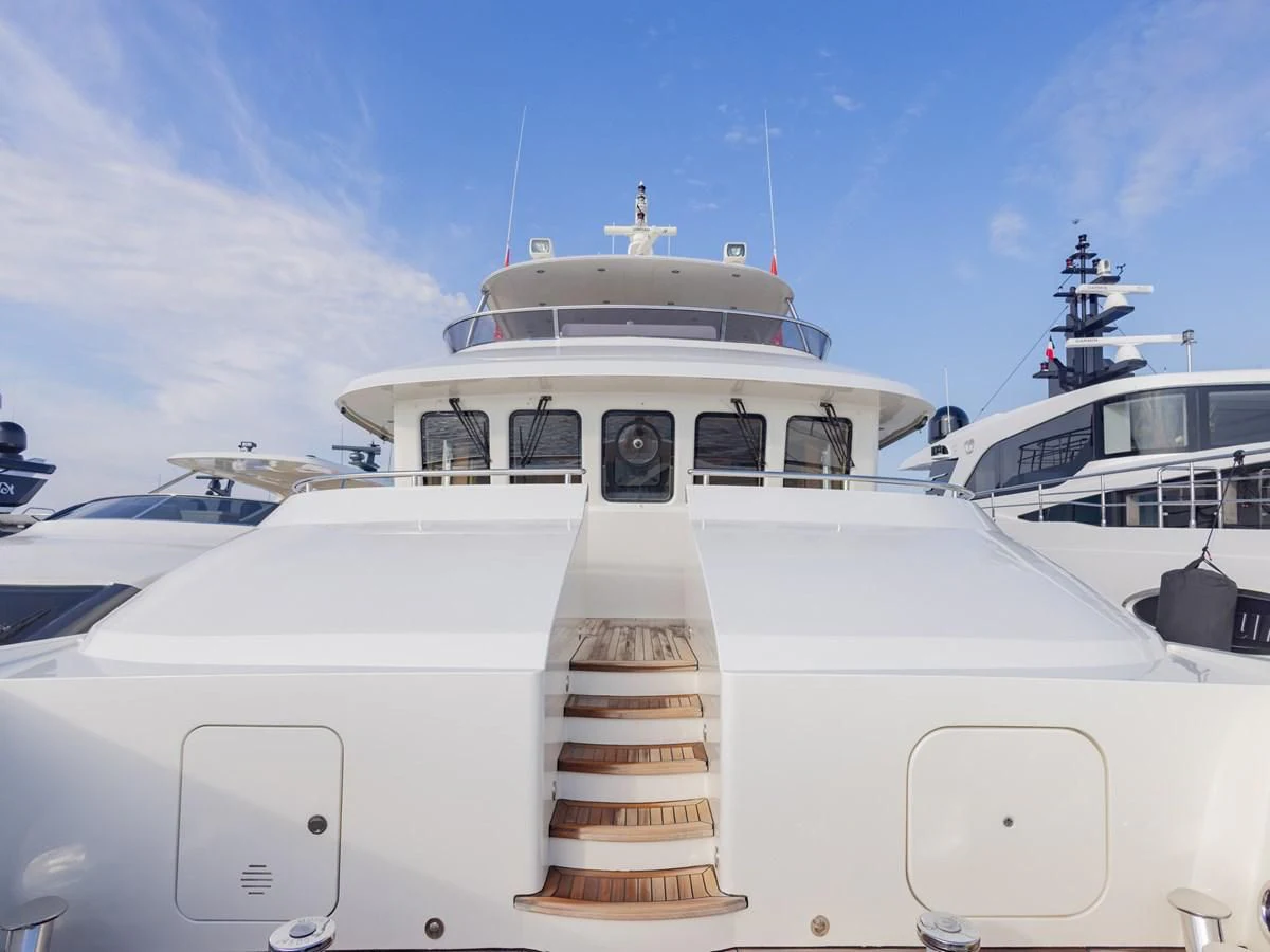 a white boat with a staircase aboard BANDIDO I Yacht for Sale
