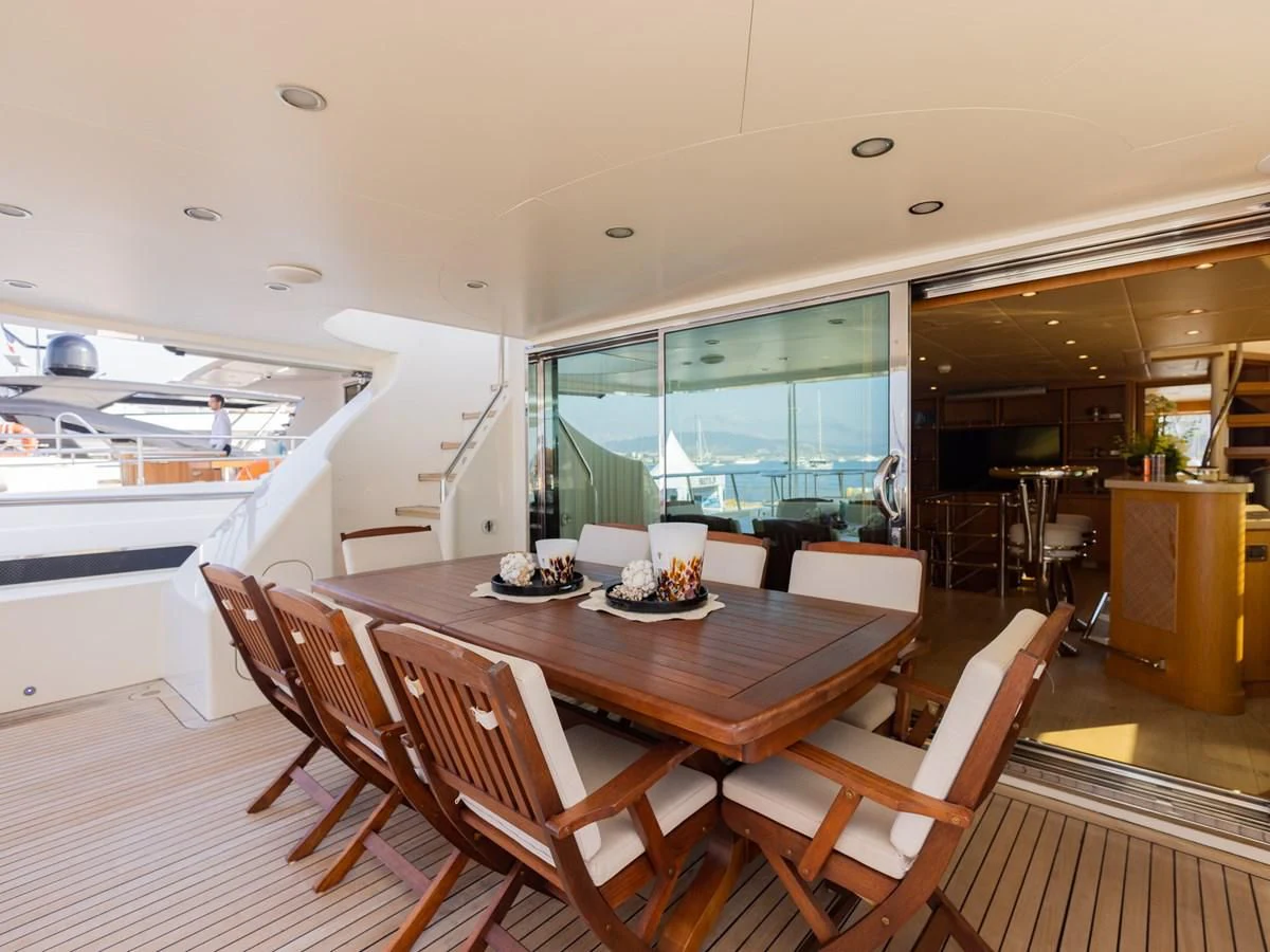 a dining room with a table and chairs aboard BANDIDO I Yacht for Sale