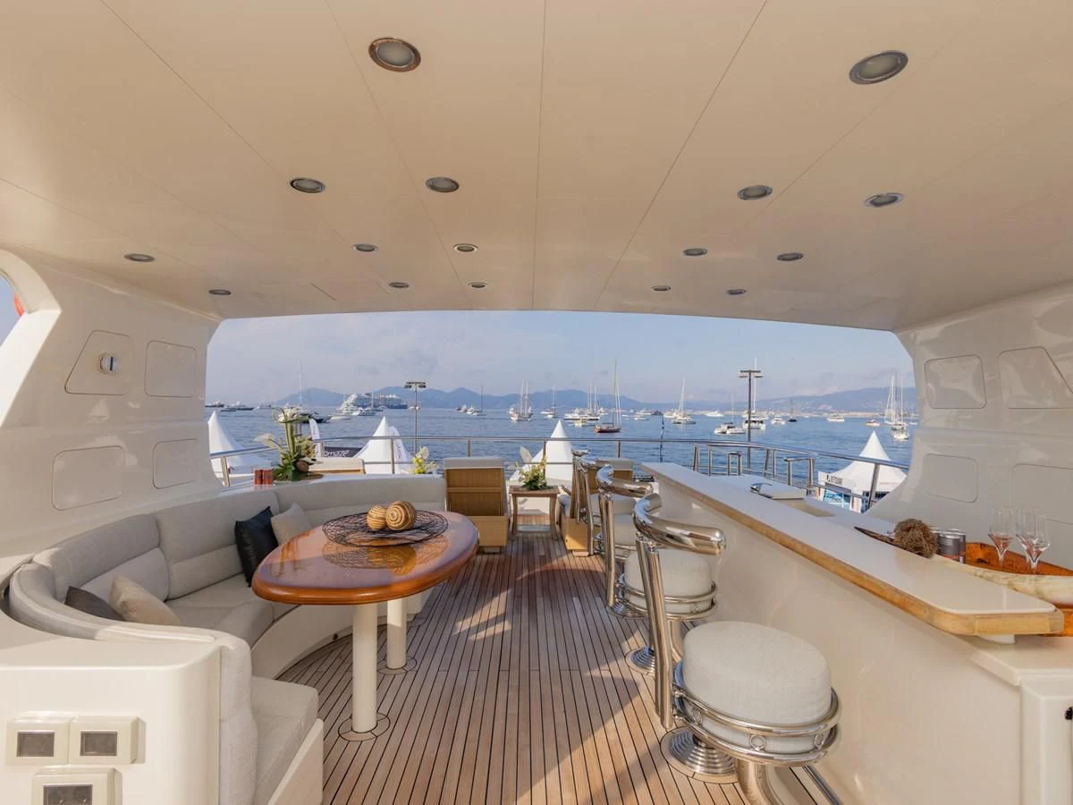 a room with a table and chairs aboard BANDIDO I Yacht for Sale