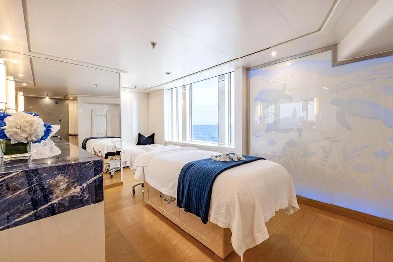 a bedroom with a large mirror aboard FELIX Yacht for Sale