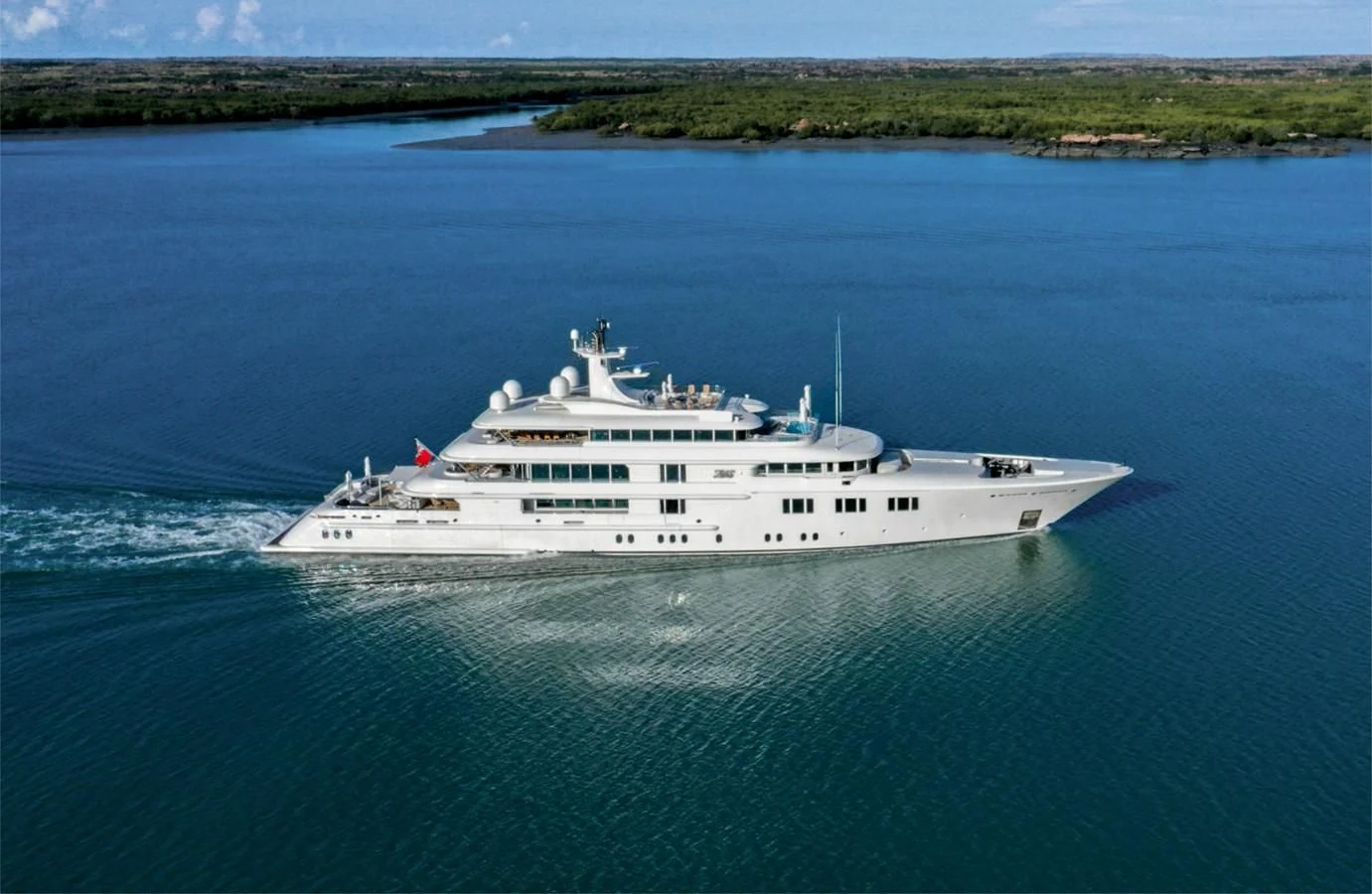 a large white ship in the water aboard FELIX Yacht for Sale