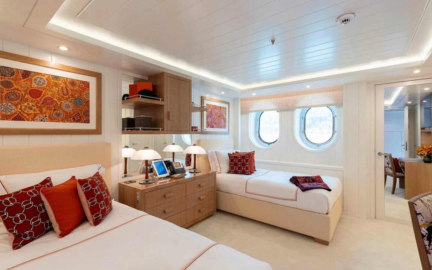 a bedroom with a bed and a window aboard FELIX Yacht for Sale