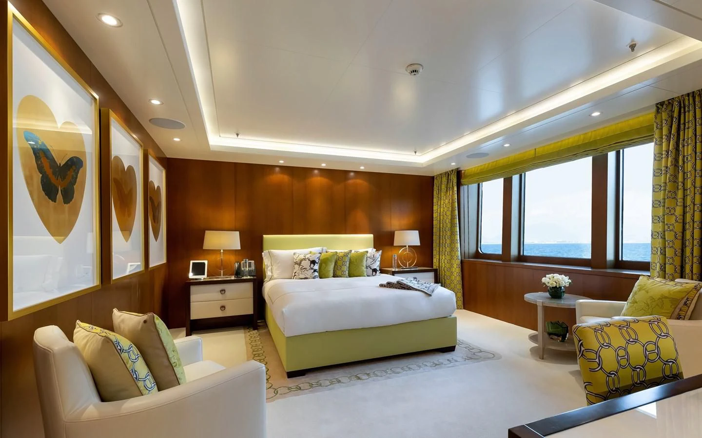 a large bedroom with a bed and a couch aboard FELIX Yacht for Sale