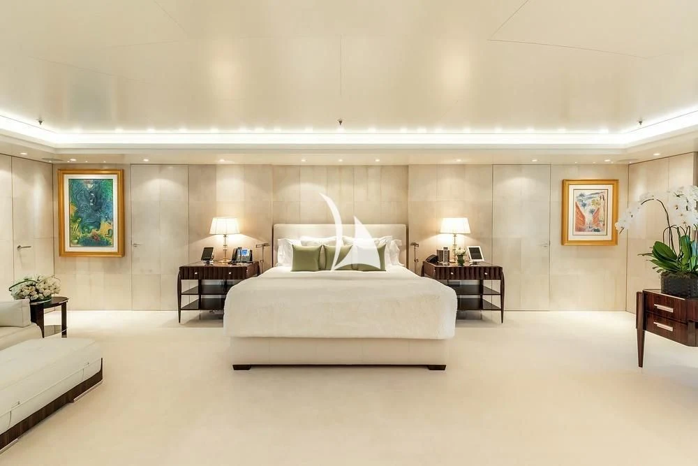 a large white bedroom with a white bed and a white bed aboard FELIX Yacht for Sale