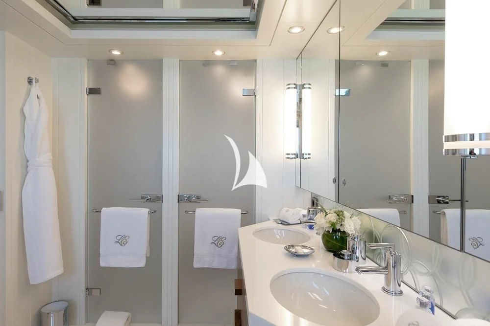 a bathroom with a large mirror aboard FELIX Yacht for Sale