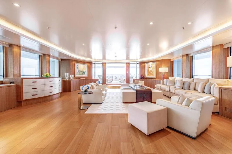 a large living room with white furniture aboard FELIX Yacht for Sale