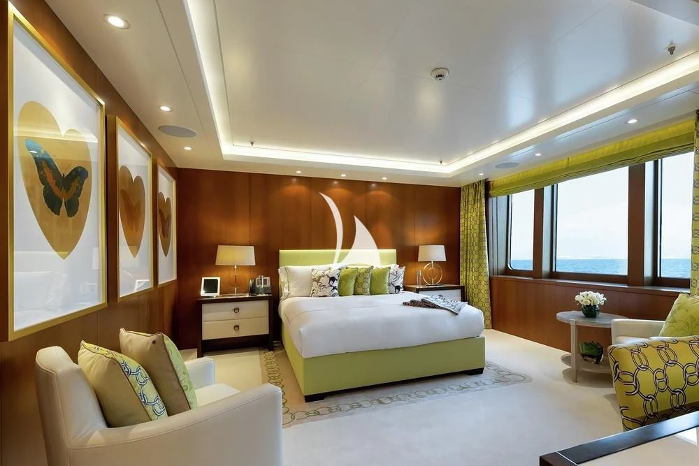 a bedroom with a large bed aboard FELIX Yacht for Sale