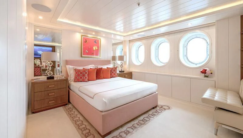 a large bedroom with a bed aboard FELIX Yacht for Sale