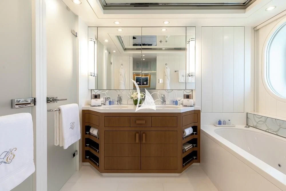 a bathroom with a large mirror aboard FELIX Yacht for Sale