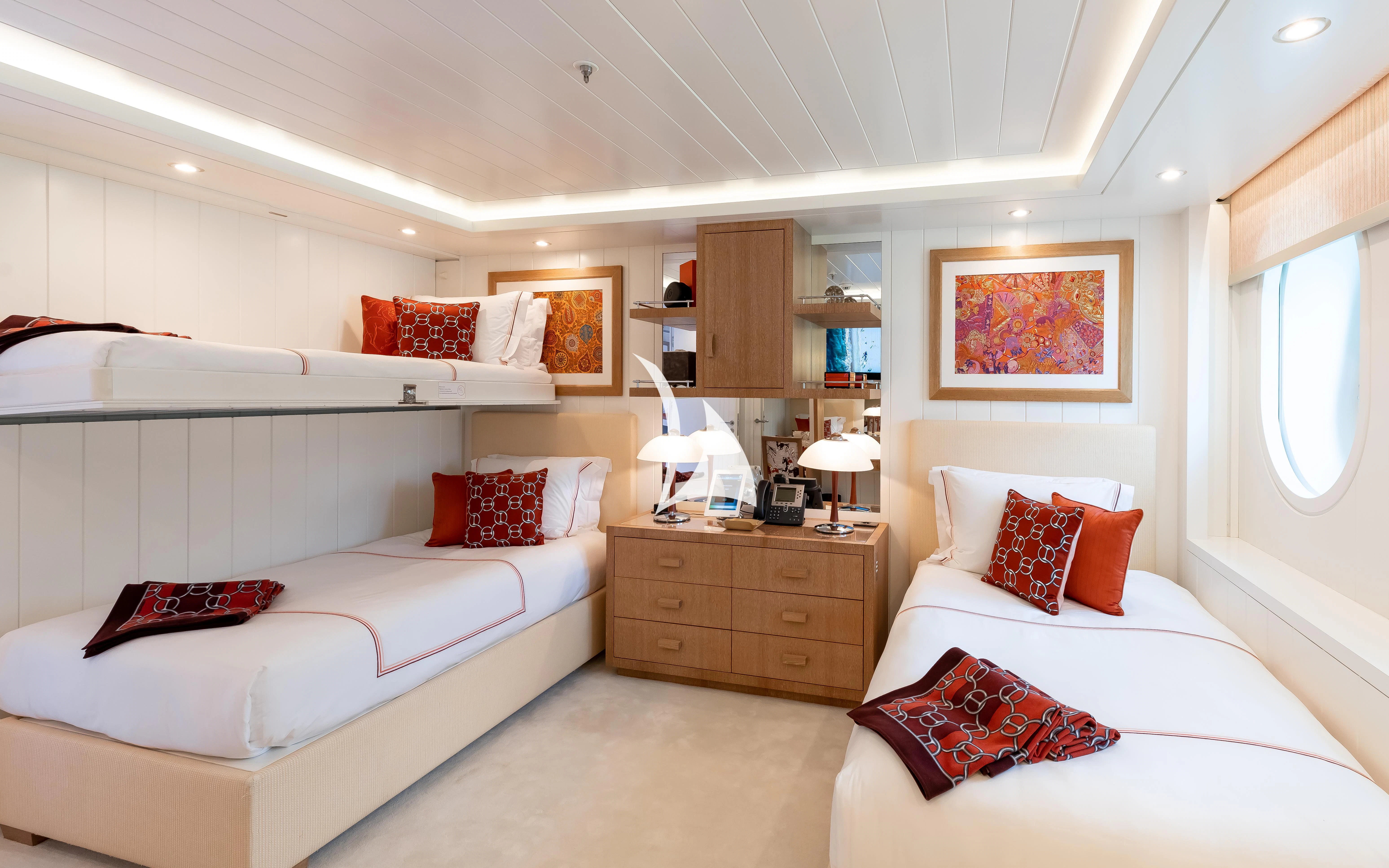 a bedroom with two beds aboard FELIX Yacht for Sale