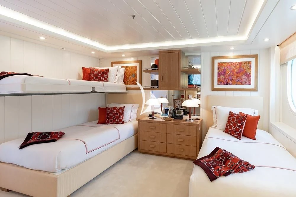 a bedroom with two beds aboard FELIX Yacht for Sale