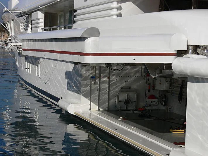 a white boat with red stripes aboard FELIX Yacht for Sale