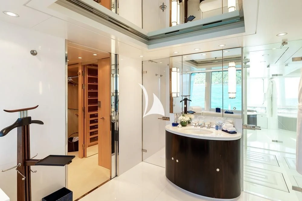 a bathroom with a large mirror aboard FELIX Yacht for Sale