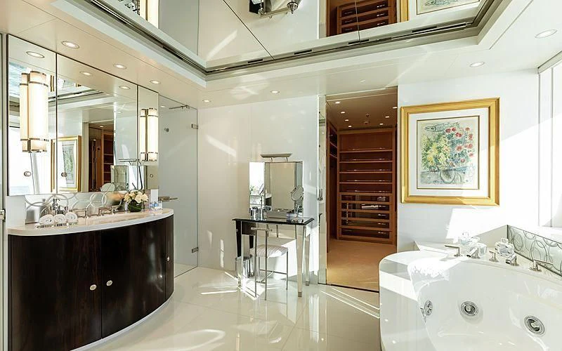 a bathroom with a large mirror aboard FELIX Yacht for Sale