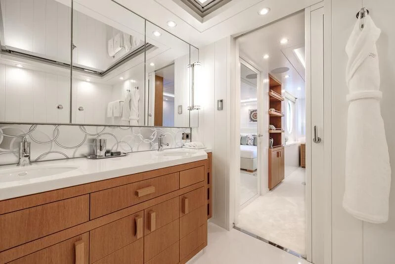 a bathroom with a sink and a mirror aboard FELIX Yacht for Sale