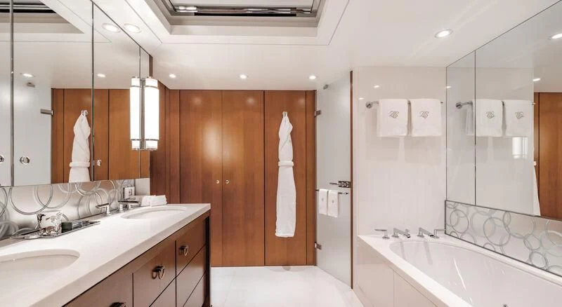 a bathroom with a bathtub and sink aboard FELIX Yacht for Sale