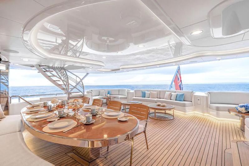 a room with a table and chairs aboard FELIX Yacht for Sale