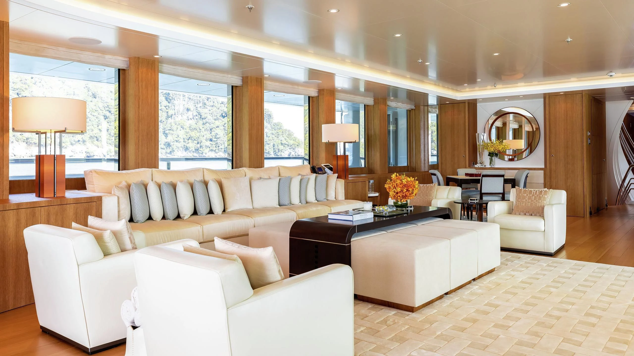 a living room with white couches aboard FELIX Yacht for Sale